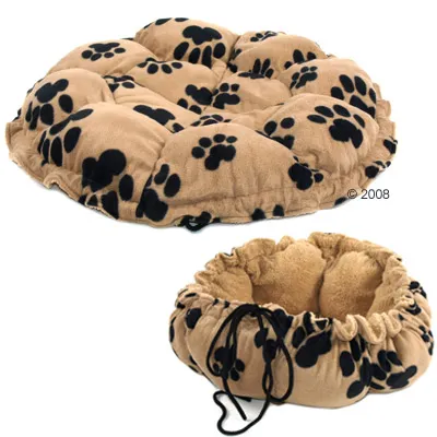 Coussin pour animaux en tissu beige à motifs pattes noires, présenté à plat et sous forme de panier rond avec cordon de serrage visible.