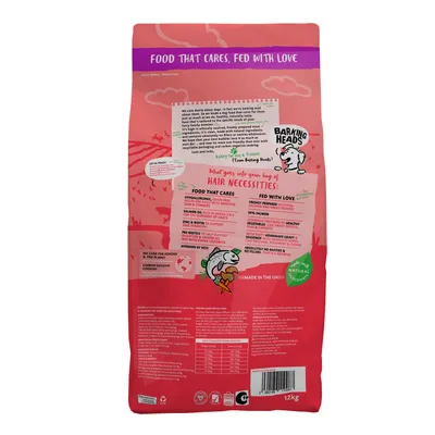 Back of pet food bag showing feeding guide, nutritional information, ingredient highlights such as hypoallergenic and salmon content, sustainability claims, and made in the UK statement.