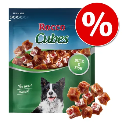 Rocco Cubes Hundesnacks mit Ente und Fisch. Wieder verschliessbare Verpackung, Text: 'The smart reward!' und rotes Rabatt-Symbol mit Prozentzeichen.