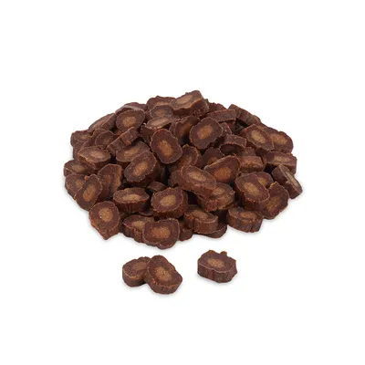 Brown, round dog snacks with light filling, loosely stacked.