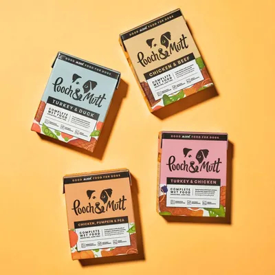 Four Pooch & Mutt complete wet food packs: Turkey & Duck, Chicken & Beef, Chicken, Pumpkin & Pea, and Turkey & Chicken. Each pack labelled as complete wet food.