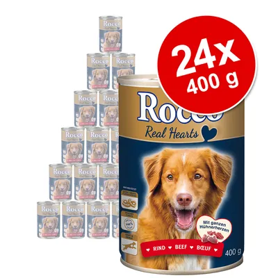 Pack de 24 latas de 400 g de Rocco Real Hearts, rótulo visível com texto 'Rind Beef Boeuf', indicação de corações de frango inteiros e símbolos de ingredientes no rótulo.