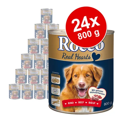 Pack de 24 latas de 800 g de comida húmida para cão Rocco Real Hearts, sabor a vaca. Texto visível: 'RIND BEEF BOEUF', ícones de carne fresca e tamanho grande.