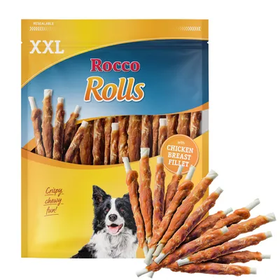 Bolsa de snacks Rocco Rolls XXL con palitos visibles, texto: 'with chicken breast fillet', 'crispy, chewy, fun!', imagen de un perro en el envase.