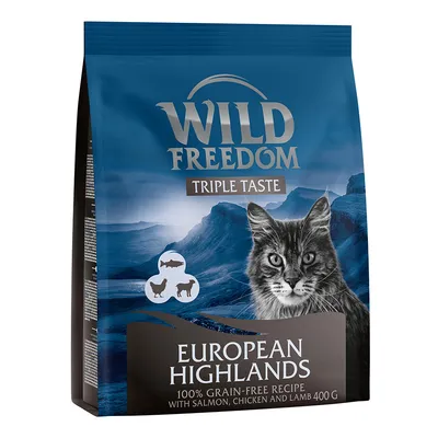 Wild Freedom Triple Taste European Highlands cat food, 100% grain-free recipe with salmon, chicken and lamb, 400g. Blue bag with cat image and mountain background.