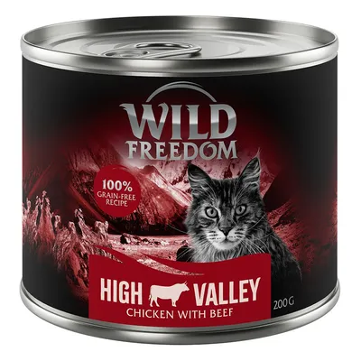 Puszka Wild Freedom High Valley Chicken with Beef 200 g, widoczny kot, napis 100% grain-free recipe. Czerwono-czarna grafika z górami w tle. Puszka Wild Freedom High Valley Chicken with Beef 200 g, widoczny kot, napis 100% grain-free recipe. Czerwono-czarna grafika z górami w tle.