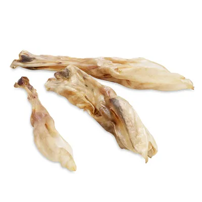 Three dried pig ears as a natural chew snack, beige-brown colour, various sizes.