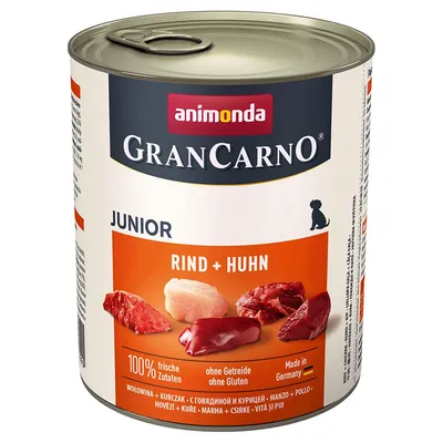Animonda GranCarno Junior Rind + Huhn. 100% świeże składniki, bez zbóż i glutenu, wyprodukowane w Niemczech. Widoczne kawałki wołowiny i kurczaka na opakowaniu.