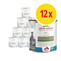 12 lattine Almo Nature HFC Natural tonno skipjack e merluzzo, ricetta senza glutine, immagine di cane sulla confezione, testo multilingue visibile sull'etichetta.
