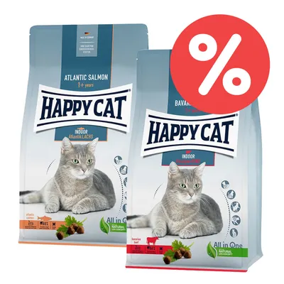 Happy Cat Indoor Katzentrockenfutter, Sorten Atlantik Lachs und Bayerisches Rind. Made in Germany, ohne künstliche Konservierungsstoffe. Prozent-Symbol für Rabattaktion sichtbar.