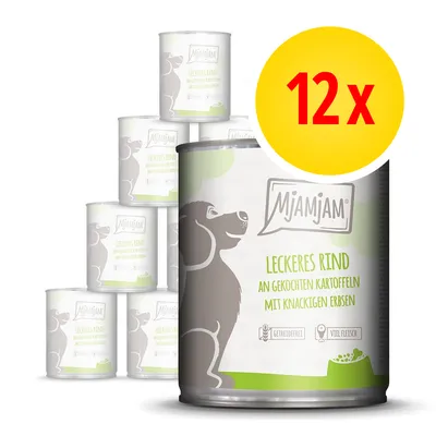 12 lattine MjAMjAM Leckeres Rind an gekochten Kartoffeln mit knackigen Erbsen, confezione visibile con illustrazione di cane e testo in tedesco sulla scatola. 12 lattine MjAMjAM Leckeres Rind an gekochten Kartoffeln mit knackigen Erbsen, confezione visibile con illustrazione di cane e testo in tedesco sulla scatola.