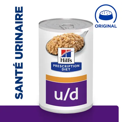 Boîte de nourriture Hill's Prescription Diet u/d, texte visible : SANTÉ URINAIRE et ORIGINAL, image d'une cuillère avec pâtée sur l'emballage. Boîte de nourriture Hill's Prescription Diet u/d, texte visible : SANTÉ URINAIRE et ORIGINAL, image d'une cuillère avec pâtée sur l'emballage.