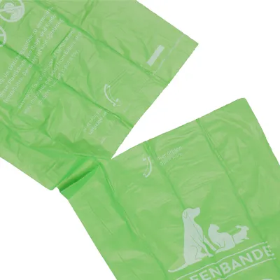 Grønne hundeposer med teksten 'Hier öffnen' og Greenbande-logo med silhuetter af hund, kat og kanin.
