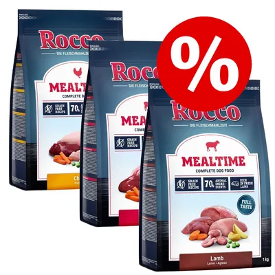 Rocco Mealtime Complete Dog Food, visible flavours include Lamb and Chicken, grain free recipe, 70% animal ingredients, special offer symbol in red with percentage sign Rocco Mealtime Complete Dog Food, visible flavours include Lamb and Chicken, grain free recipe, 70% animal ingredients, special offer symbol in red with percentage sign
