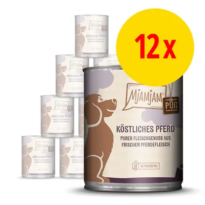 Lot de 12 boîtes MjAMjAM PUR Köstliches Pferd, texte en allemand : purer Fleischgenuss aus frischem Pferdefleisch, getreidefrei. Illustration de chien sur l’emballage.