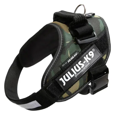 JULIUS-K9 koiran valjaat, näkyvissä merkintä 'IDC by JULIUS-K9 Glowing in dark', musta ja vihreä kangas, muovinen solki ja metallinen kiinnitysrengas.