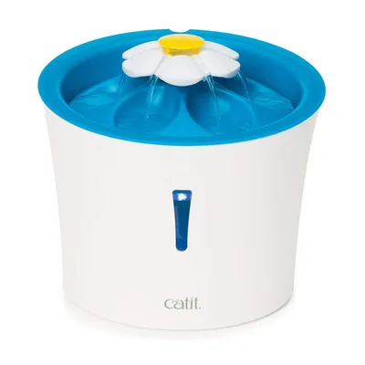 Water fountain with blue top and flower-shaped spout, showing multiple water streams flowing from the centre. Visible water level indicator on front.