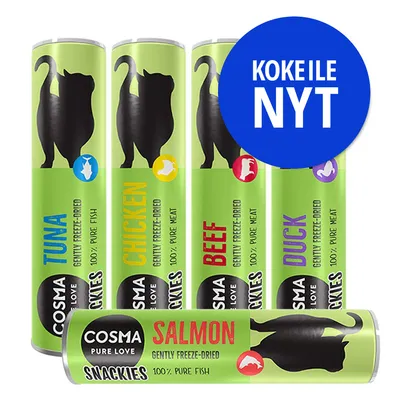 COSMA PURE LOVE SNACKIES: TUNA, CHICKEN, BEEF, DUCK, SALMON. KOKEILE NYT -teksti sinisessä ympyrässä. Pakkauksissa teksti 'gently freeze-dried', '100% pure meat/fish'.