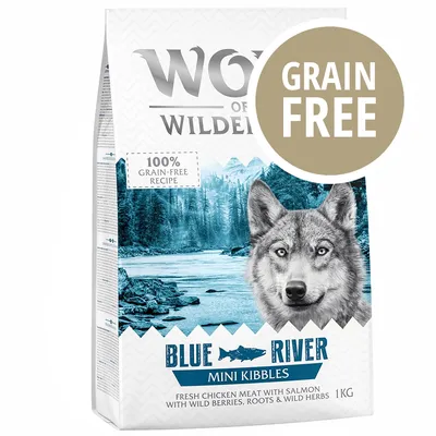 Wolf of Wilderness Blue River Mini Kibbles, 1 kg, 100% grain-free recipe, carne di pollo fresco con salmone, frutti di bosco selvatiche, radici ed erbe. Scritta GRAIN FREE in evidenza.
