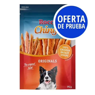 Rocco Chings Originals, tiras de pechuga de pollo 100 %, paquete de 75 g. Texto visible: 'OFERTA DE PRUEBA', 'The original taste!', imagen de un perro en el envase.