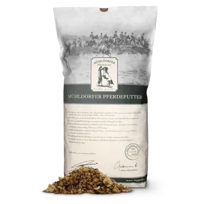 Sac de nourriture pour chevaux Mühldorfer Pferdefutter avec mélange visible devant le paquet. Texte allemand et illustration équestre sur l’emballage.