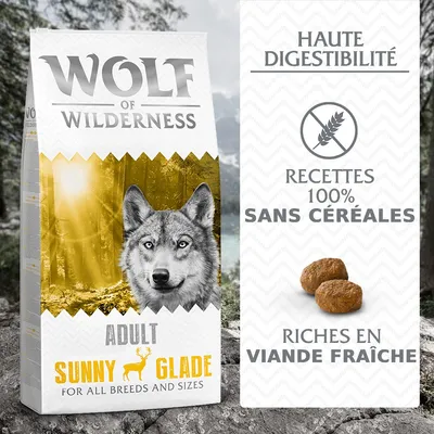 Wolf of Wilderness Adult Sunny Glade, haute digestibilité, recettes 100 % sans céréales, riches en viande fraîche. Croquettes visibles à droite de l’emballage. Wolf of Wilderness Adult Sunny Glade, haute digestibilité, recettes 100 % sans céréales, riches en viande fraîche. Croquettes visibles à droite de l’emballage.