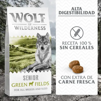 Wolf of Wilderness Senior Green Fields. Alta digestibilidad, receta 100 % sin cereales, con extra de carne fresca. Imagen de croquetas y paisaje en el envase.