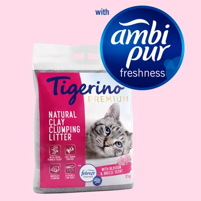 Arena aglomerante para gatos Tigerino Premium, 12 kg, con fragancia Febreze y Ambi Pur. Texto visible en inglés: natural clay clumping litter, with blossom & breeze scent.