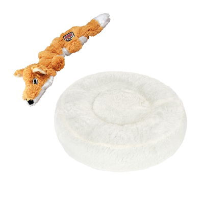 Plüschspielzeug in Fuchsform und rundes, weißes Kuschelbett mit rotem Prozentzeichen für Rabattaktion.