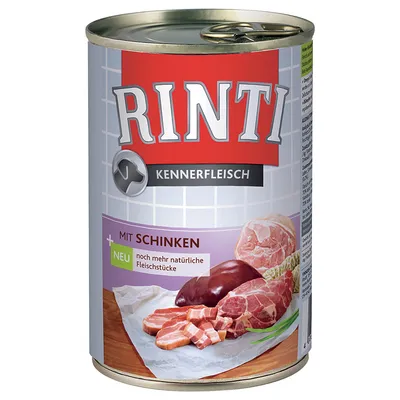 Conservă Rinti Kennerfleisch, text vizibil: MIT SCHINKEN, NEU noch mehr natürliche Fleischstücke. Imagine cu bucăți de carne pe etichetă. Textul este în limba germană.