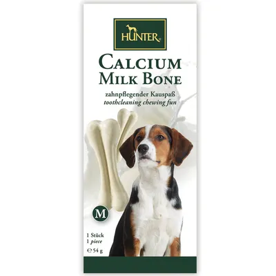 Hunter Calcium Milk Bone, tamaño M, 1 pieza de 54 g. Texto visible: toothcleaning chewing fun. Imagen de hueso blanco y perro en el envase. Hunter Calcium Milk Bone, tamaño M, 1 pieza de 54 g. Texto visible: toothcleaning chewing fun. Imagen de hueso blanco y perro en el envase.