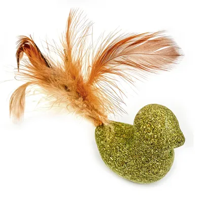 Toy in the shape of a green duck made from pressed grass with brown feathers on the tail.