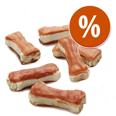 Snack em forma de osso com camada exterior castanha e interior claro, conjunto de sete unidades. Círculo laranja com símbolo de percentagem branco indica promoção ou desconto.