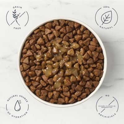 Bowl with brown kibbles and gravy. Text: Grain free, 100% natural, Natural source of hydration, No colours, flavours or preservatives, no artificials.