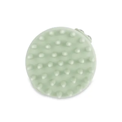 Ronde, groene massageborstel met nopjes voor vachtverzorging of reiniging.