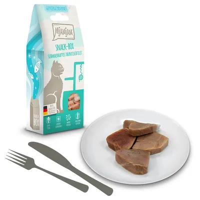 Mjamjam Snack-Box med velsmagende tunfiskefilet, bedste kvalitet, 100% kød, uden korn, højt proteinindhold. Emballage og serveret produkt på tallerken synlige.