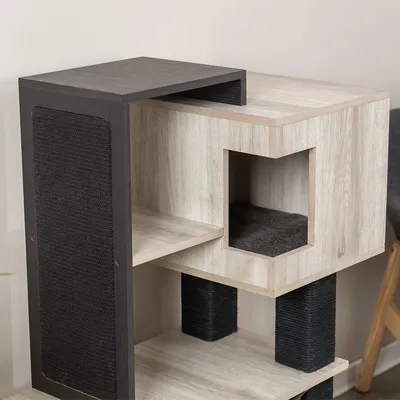 Cat furniture made of wood with multiple levels, black scratching surface and integrated retreat area.