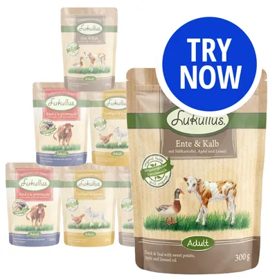 Selection of Lukullus Adult food pouches in various flavours, including duck and veal with sweet potato, apple and linseed oil. Blue circle with white text: Try Now.