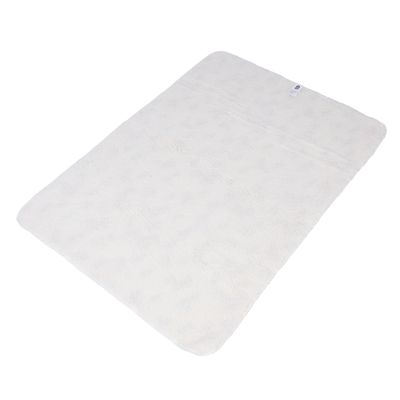 White rectangular mat with soft surface and label at top right.