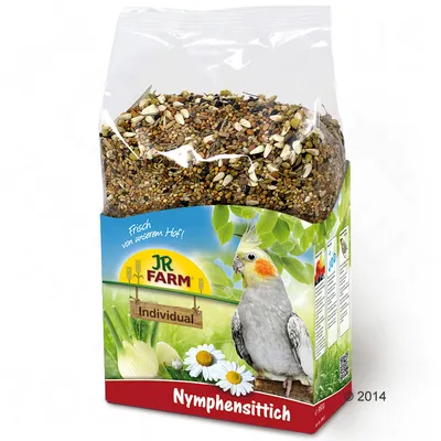 JR Farm Individual Nymphensittich, mješavina hrane s kamilicom i komoračem, svježe s farme. Pakiranje prikazuje nimfu na zelenoj pozadini.
