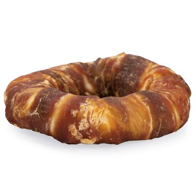 Kulatý žvýkací pamlsek ze sušeného masa, hnědý se zlatými akcenty.