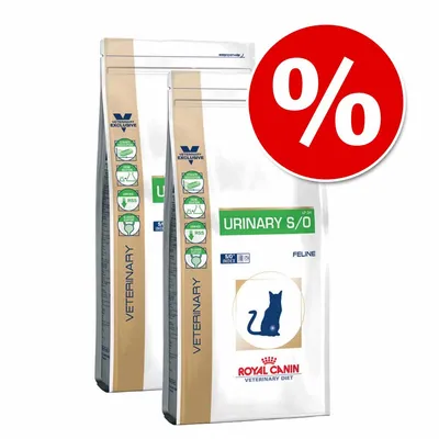 Two bags of Royal Canin Veterinary Diet Urinary S/O Feline cat food with green and beige labels, blue cat silhouette, and large red percent discount symbol in top right corner.