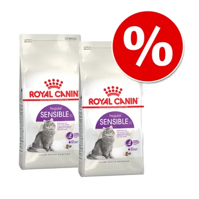 Kaksi Royal Canin Regular Sensible 33 -kuivaruokapussia kissoille, pakkauksissa harmaa kissa ja violetti etiketti. Punainen alennusmerkki (%) oikeassa yläkulmassa.