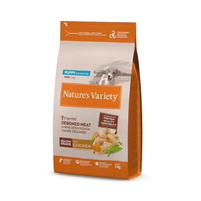 Embalagem de ração Nature’s Variety Puppy Mini (0–10 kg), 3 kg, com carne desossada como primeiro ingrediente e cereais integrais com frango. Indicações em inglês e imagem de cachorro.