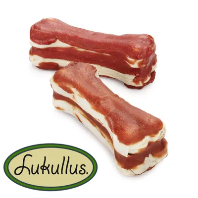 Lukullus Kauknochen mit weiss-rotem Fleischmix, zwei Stück sichtbar. Lukullus Kauknochen mit weiss-rotem Fleischmix, zwei Stück sichtbar.