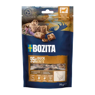 Bozita masové pamlsky pro psy, 95 % kachna, s borůvkovým olejem a květem levandule. Balení zobrazuje produkt a obsahuje 70 g. Recyklovatelné.