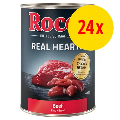 Rocco Real Hearts Beef 400 g, med teksten 'WITH WHOLE CHICKEN HEARTS', pakke med 24x dåser. Synligt oksekød og hjerter på emballagen.