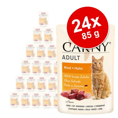 Carny Adult Beef + Chicken, 24x85g, 100% fresh ingredients, grain-free, Made in Germany. Packaging with red circle and cat shown.