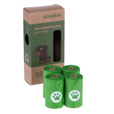 Boîte zooplus Hundekotbeutel poop bags avec 4 rouleaux de sacs verts, motif patte blanche. Texte visible : 60 x bio Hundekotbeutel, symbole recyclage.