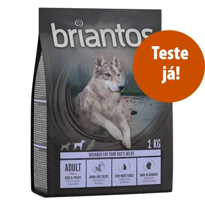 Embalagem de ração briantos Adult Duck & Potato, 1 kg. Texto visível: 'Grain-free recipe', 'Semi-moist kibble', 'Made in Germany'. Selo laranja: 'Teste já!'.